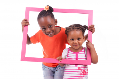 cute little girls holding a picture frame