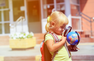 little girl holding globe